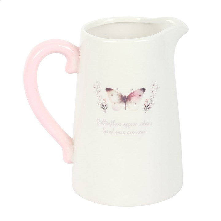 Butterfly design ceramic jug used as a vase for fresh flowers
