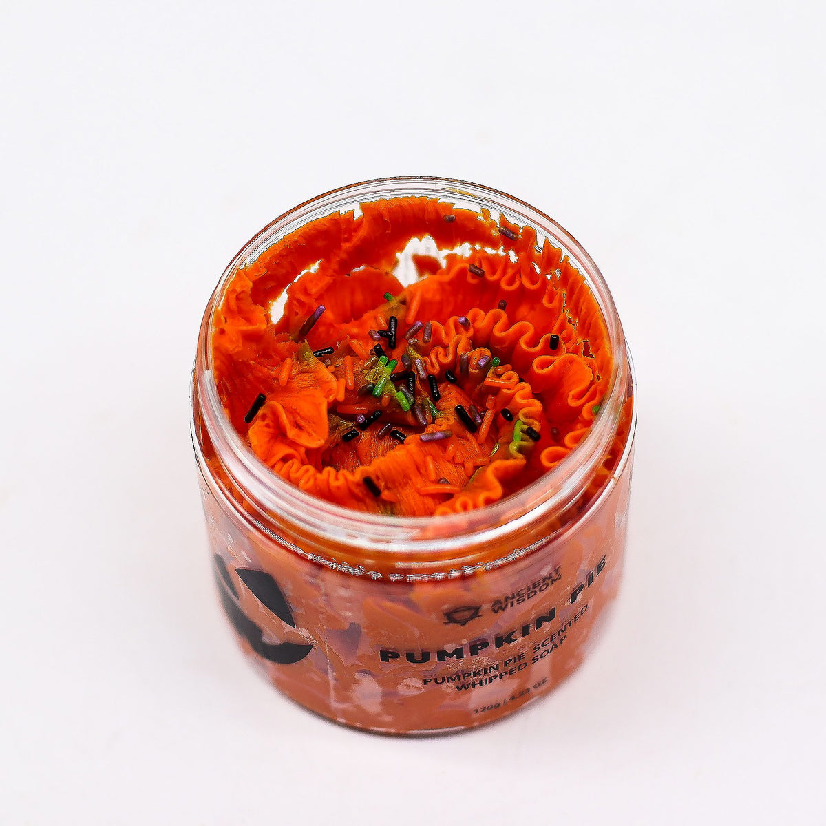 Jar of pumpkin spice candle on a white background