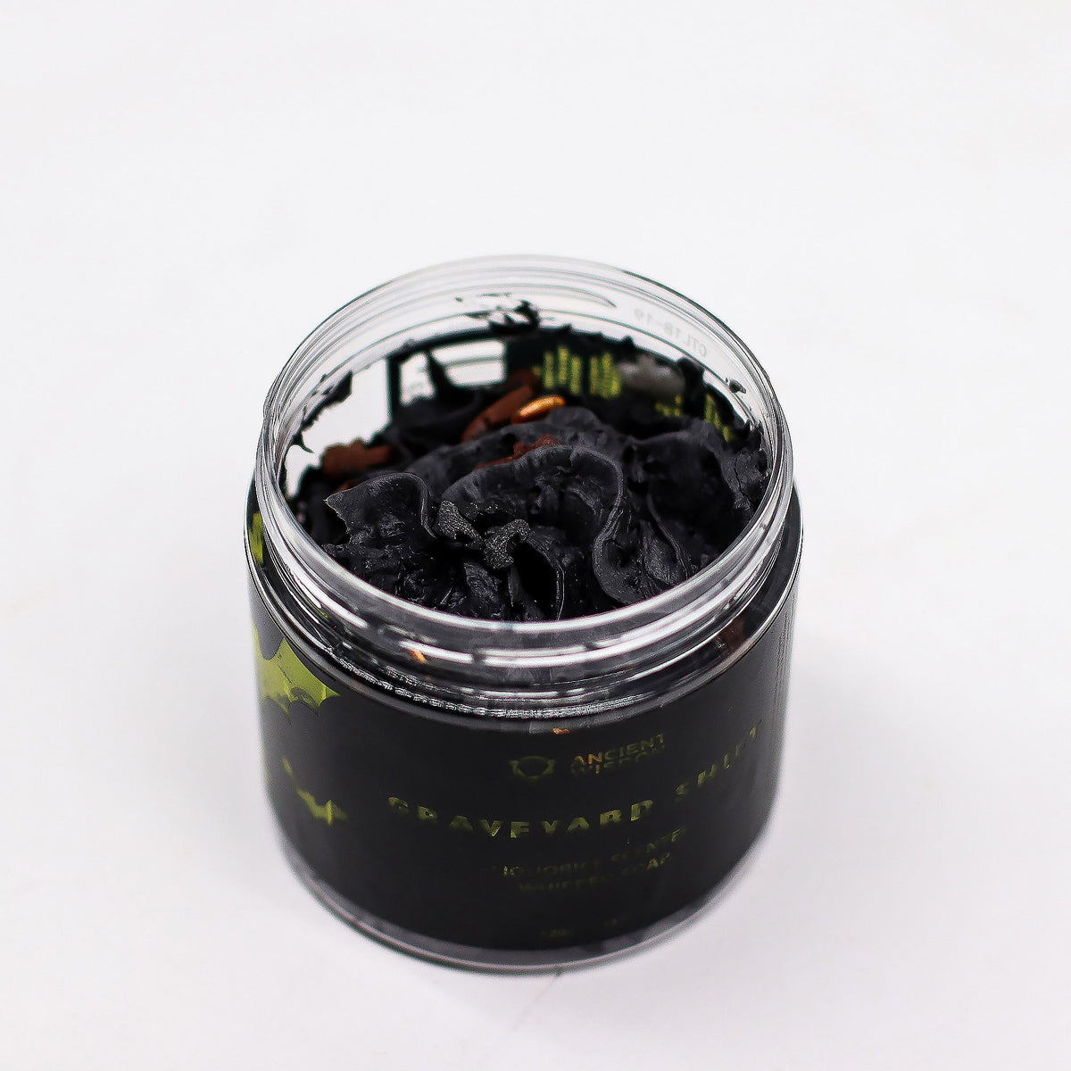 Black container with a lid on a white background