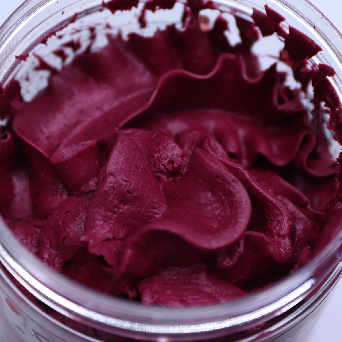 Close-up of a container filled with cherry whipped soap