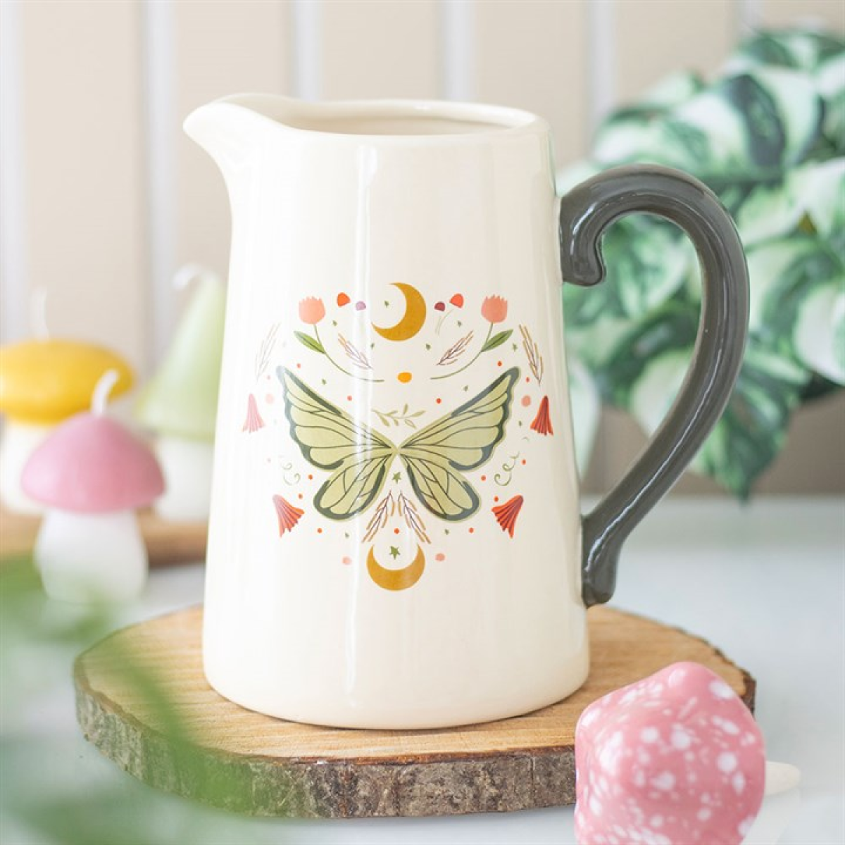 Ceramic flower jug with whimsical fairy wing design in white